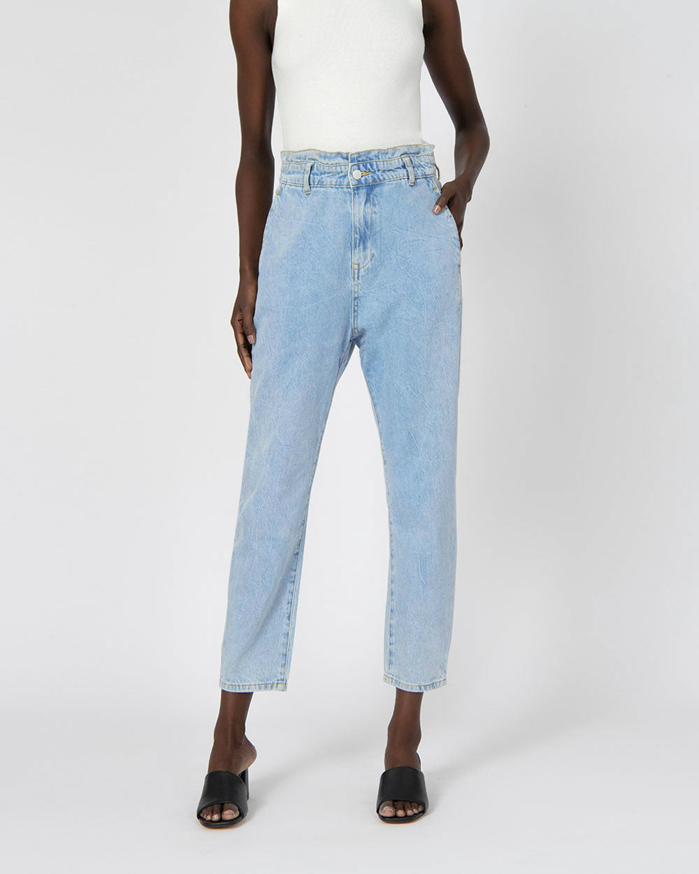 Aubri High-Waisted Jeans in light wash — close-up view