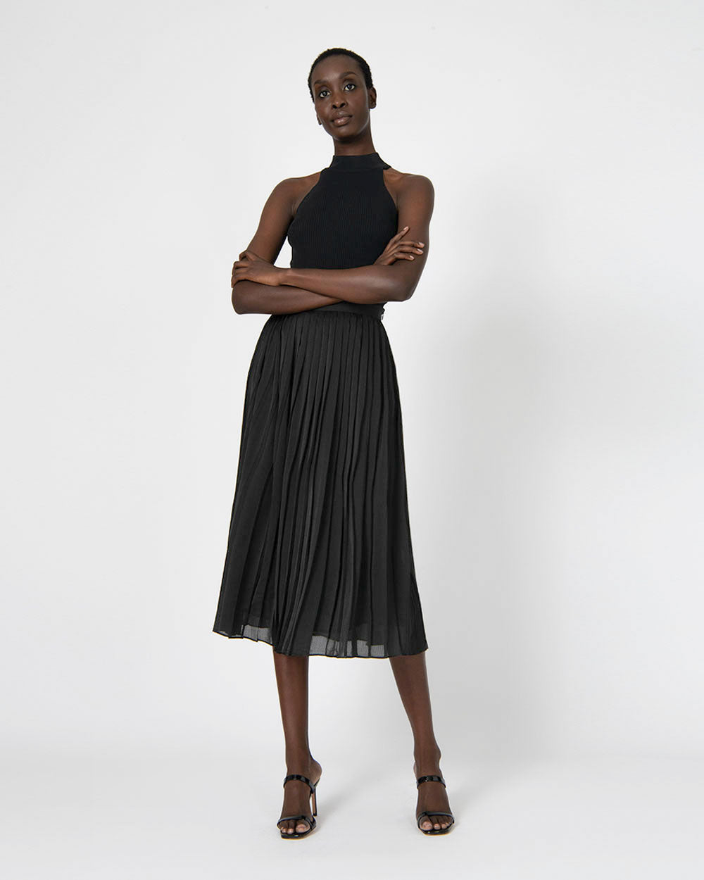 Rosy Pleated Skirt in black — full-length view