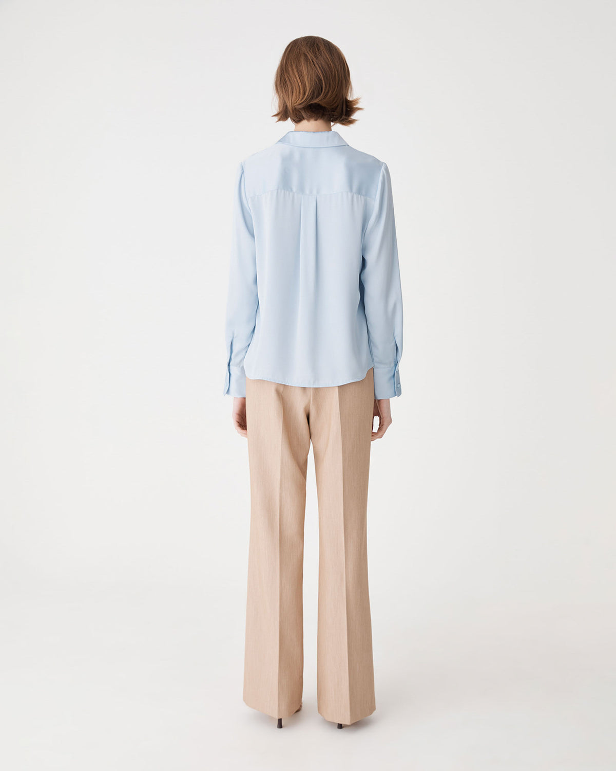Lila V-Neck Satin Blouse in powder blue — back view