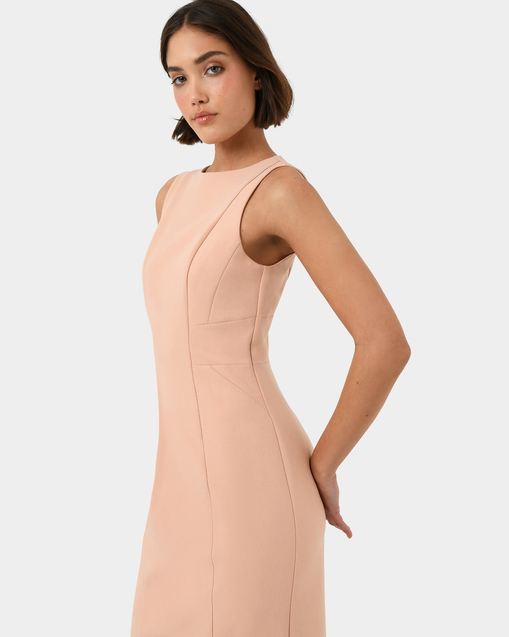 Luna Sleeveless Dress in pastel peach — side view 2