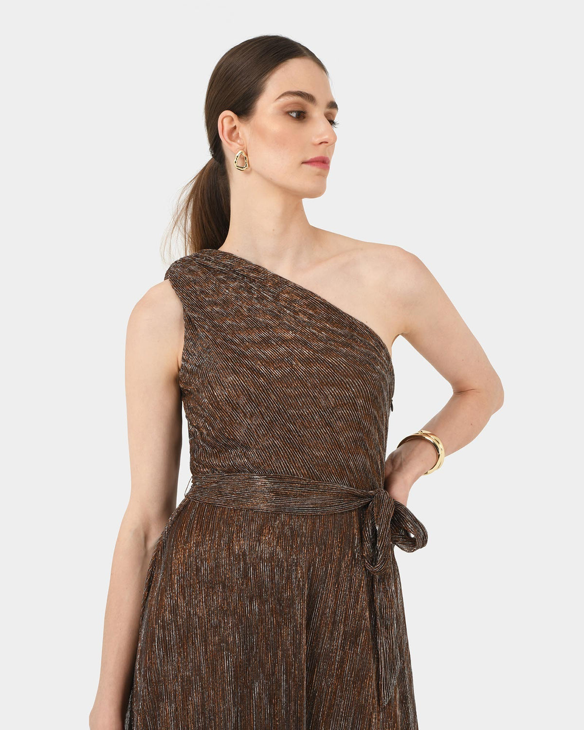 Avah One Shoulder Dress in metallic bronze — close-up view
