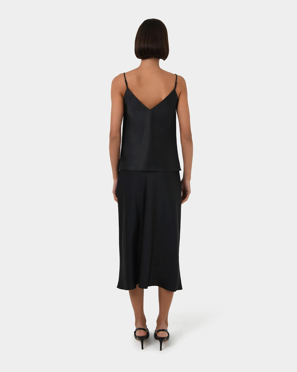 Joy Satin Midi Skirt in black — back view