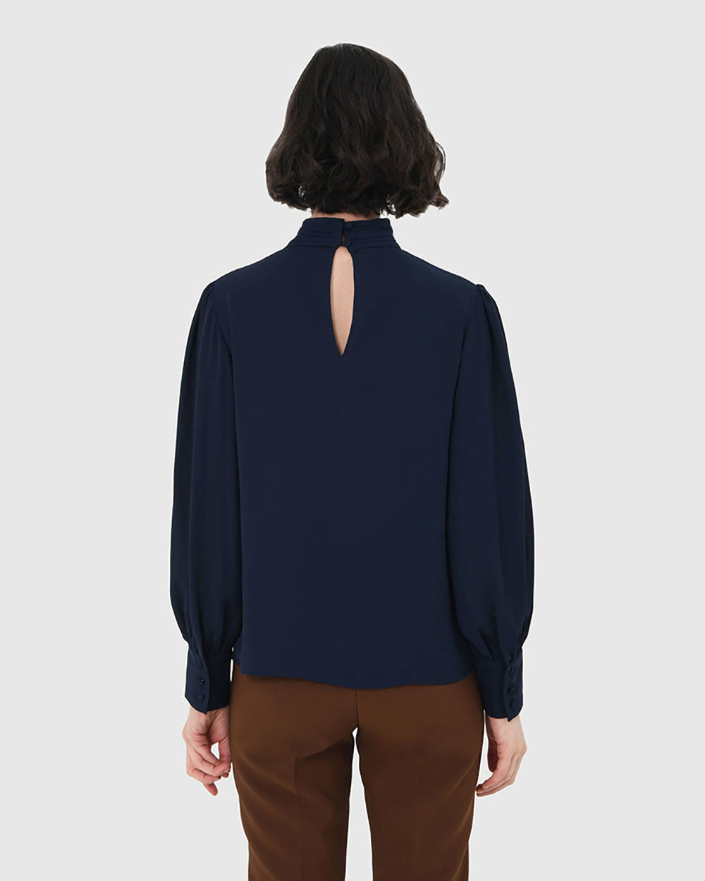 Korra High Neck Blouse in navy — back view