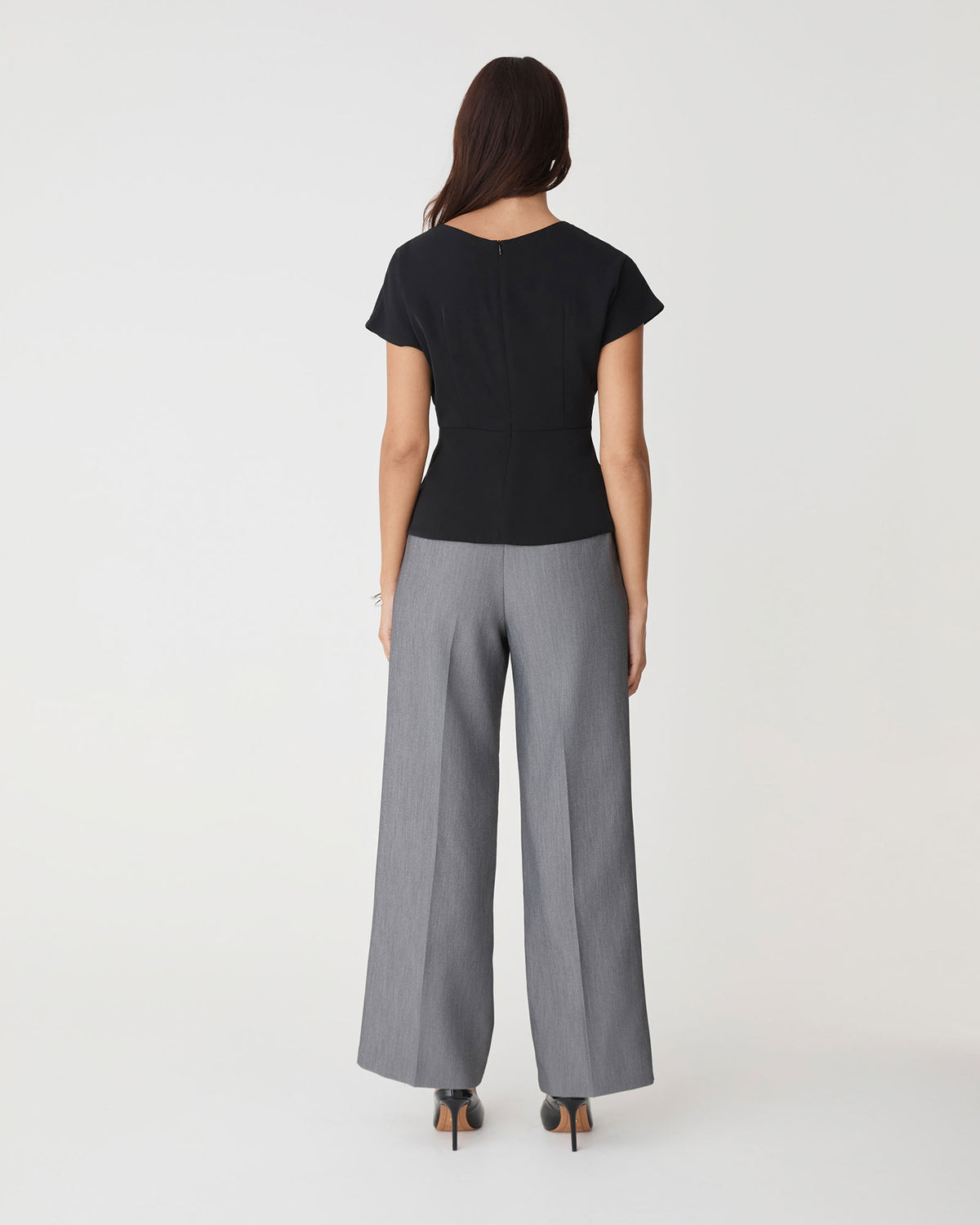 Bonnie Gathered Peplum Top in black — back view