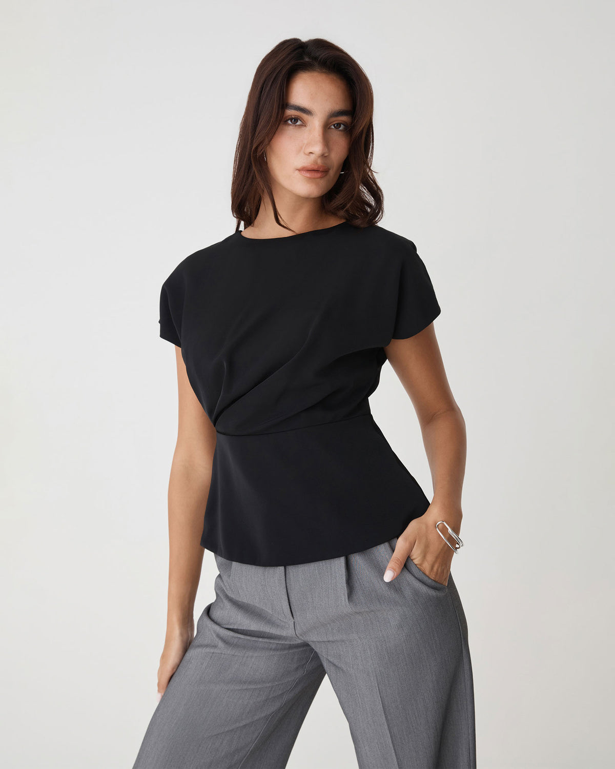 Bonnie Gathered Peplum Top in black — close-up view