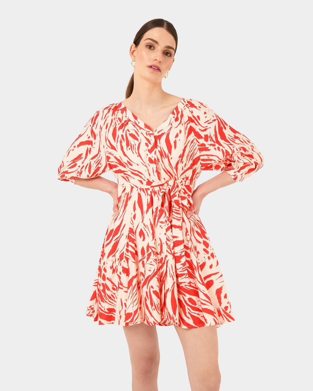 Vienna V-Neck Tie Dress in animal red — close-up view
