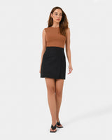 Nia Mini Linen Skirt in black — full-length view