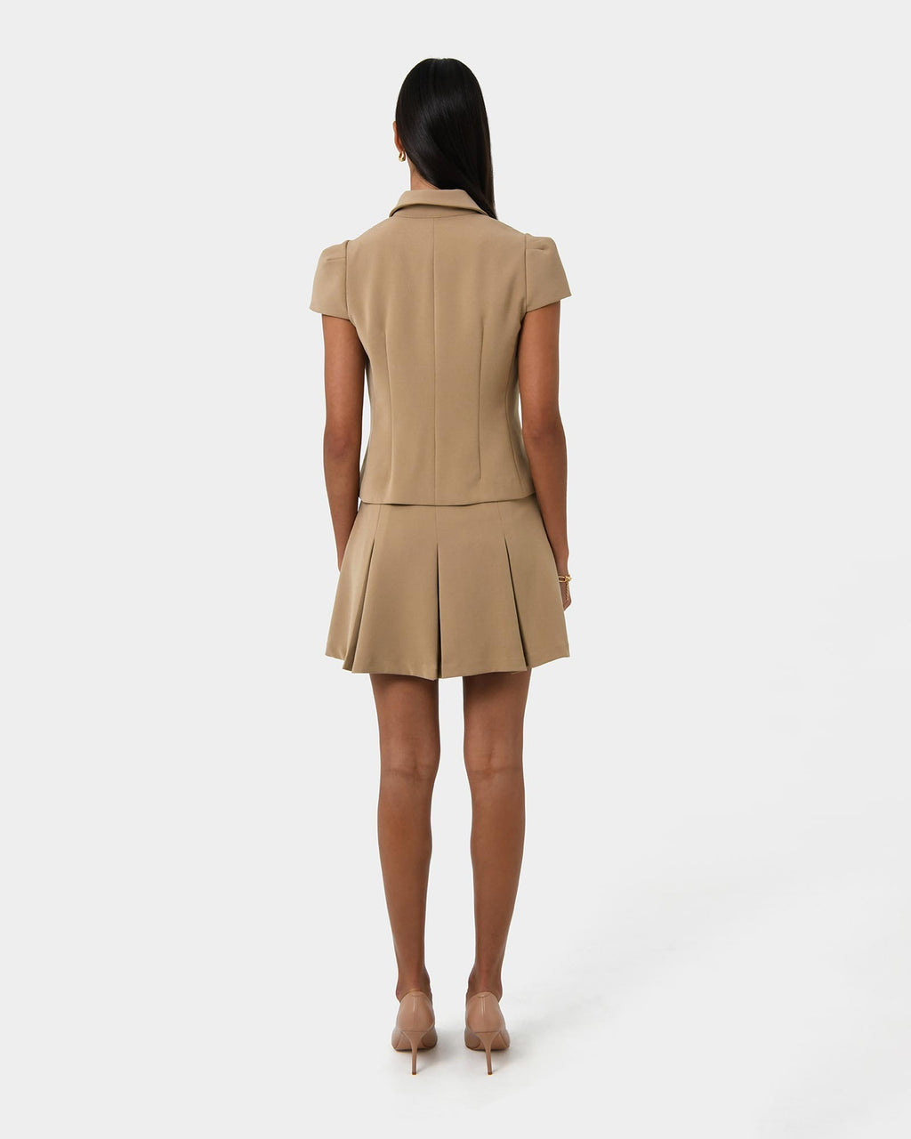 Ace Pleated Skirt in tan — back view