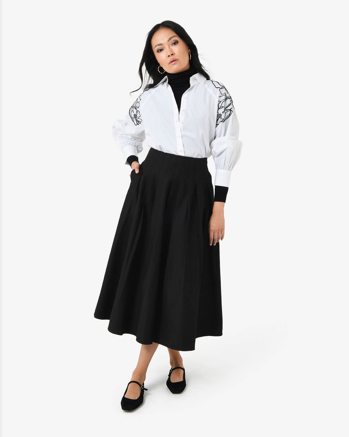 Heira Pleated Midi Skirt in black — full-length view