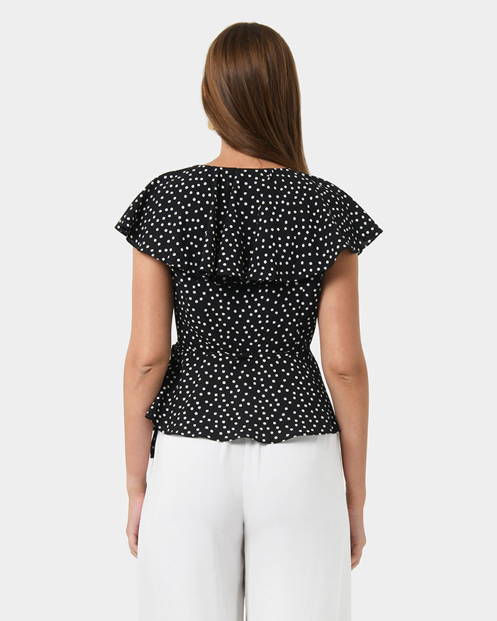 Jules Ruffle Wrap Blouse in polka dot — back view