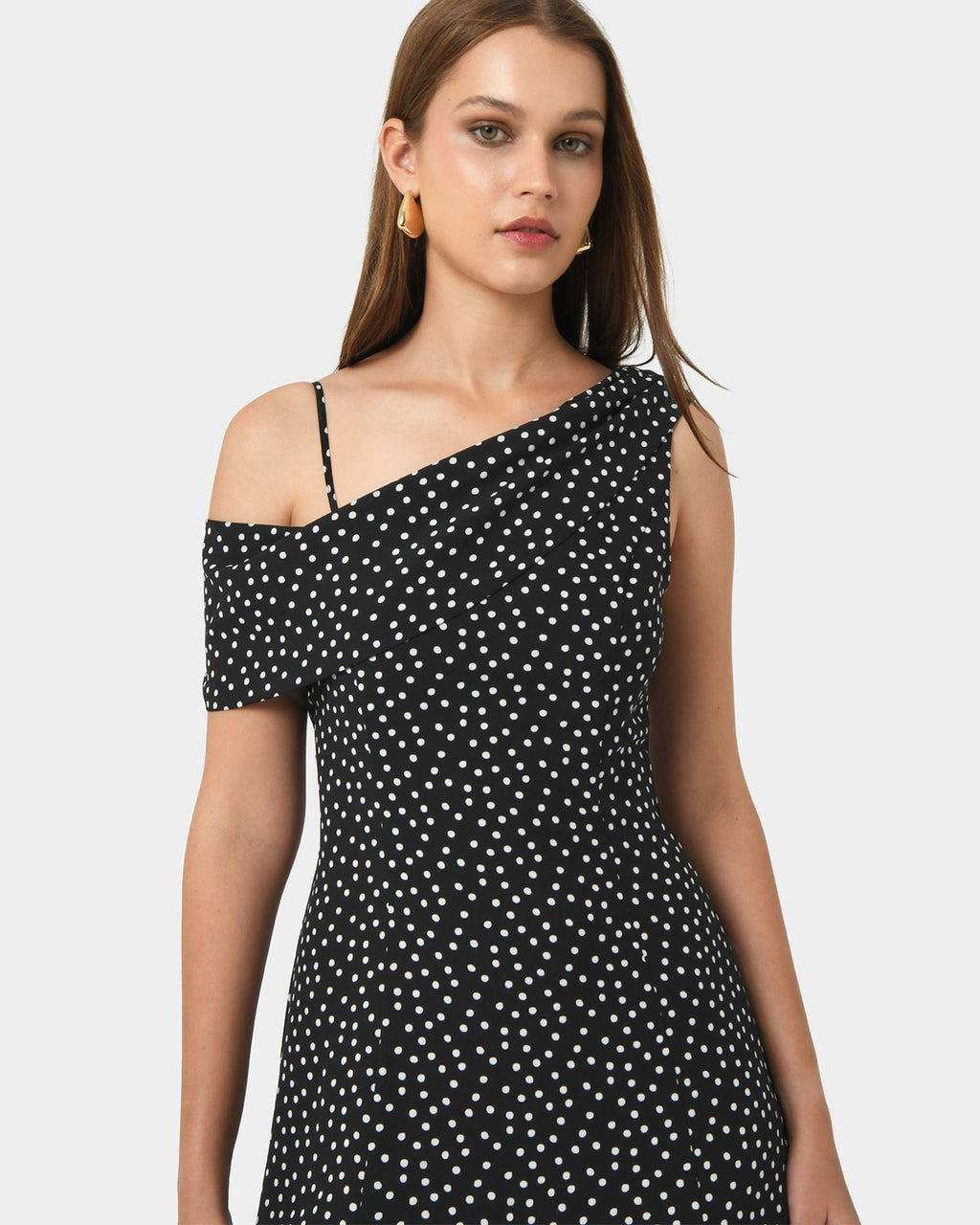 Jules Asymmetric Maxi Dress in polka dot — close-up view