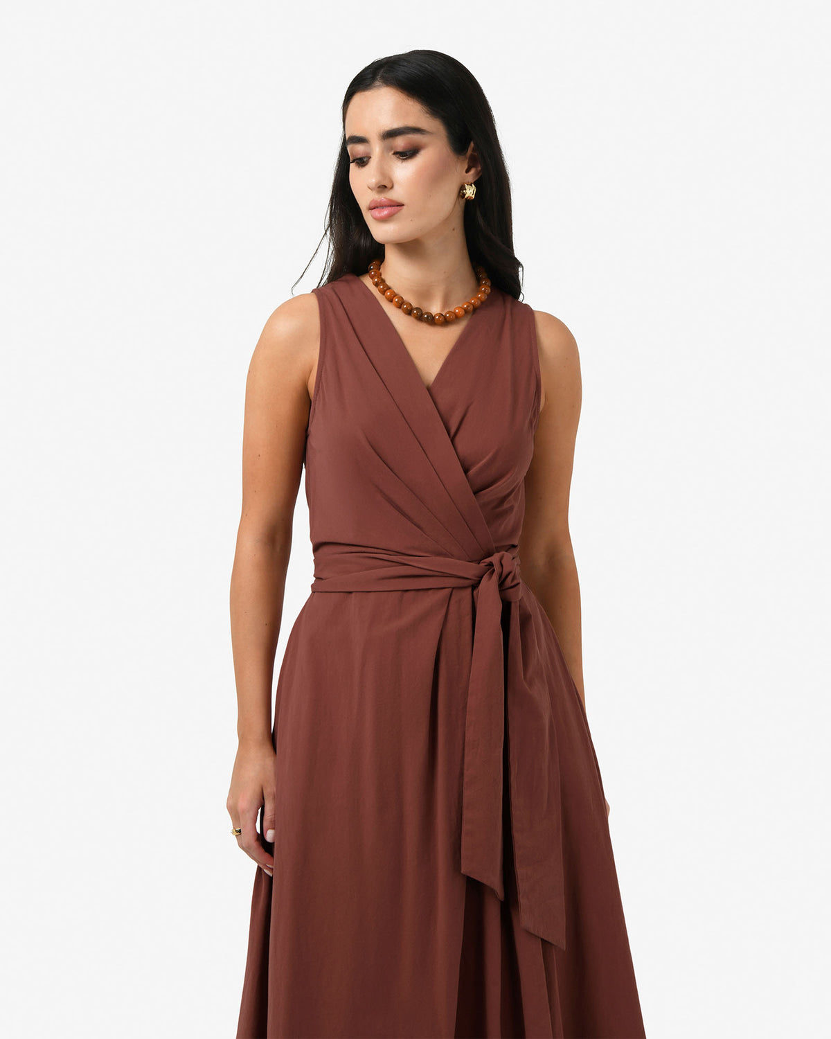 Nattai Crossover Dress in terracotta — close-up view