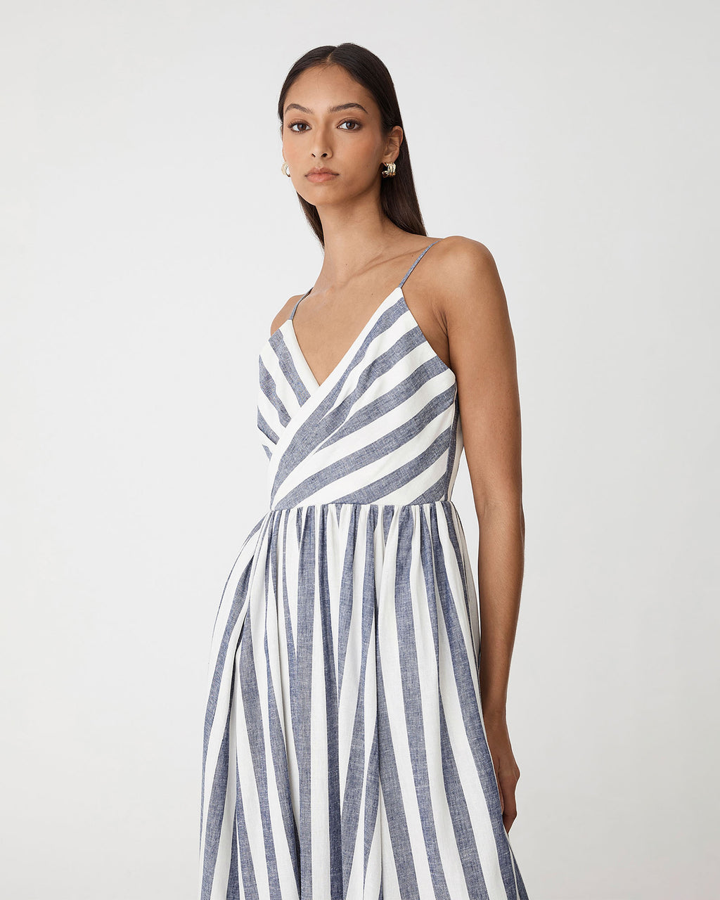 Ikaria Linen Crossover Dress in blue stripe — close-up view