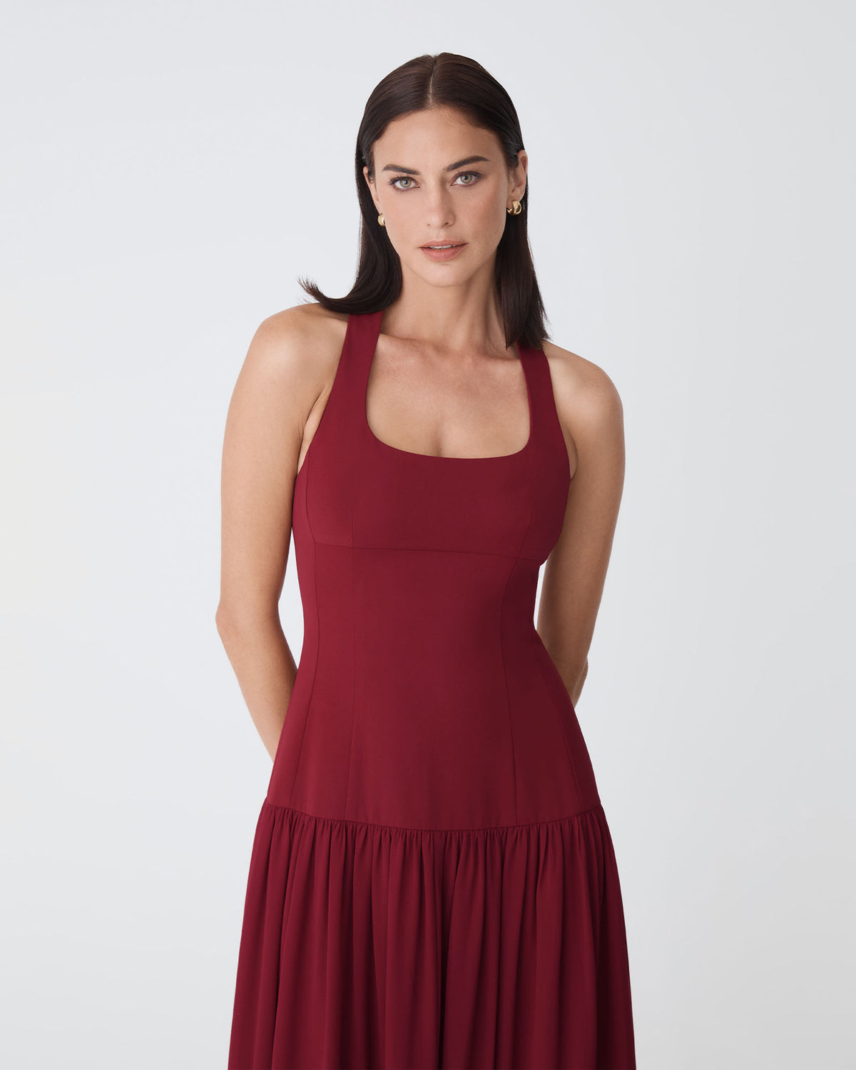 Selena Dropped Waist Dress in deep red — close-up view