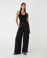 Ami Wide Leg Linen Pants in black — full-length view