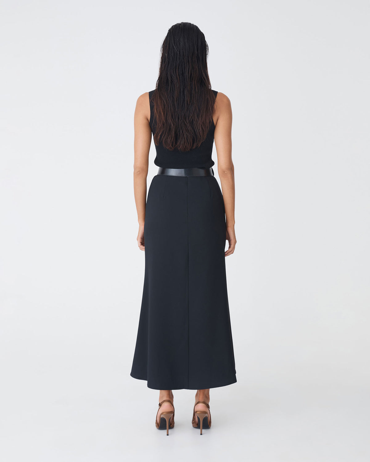 Caris Flared Maxi Skirt in black — back view