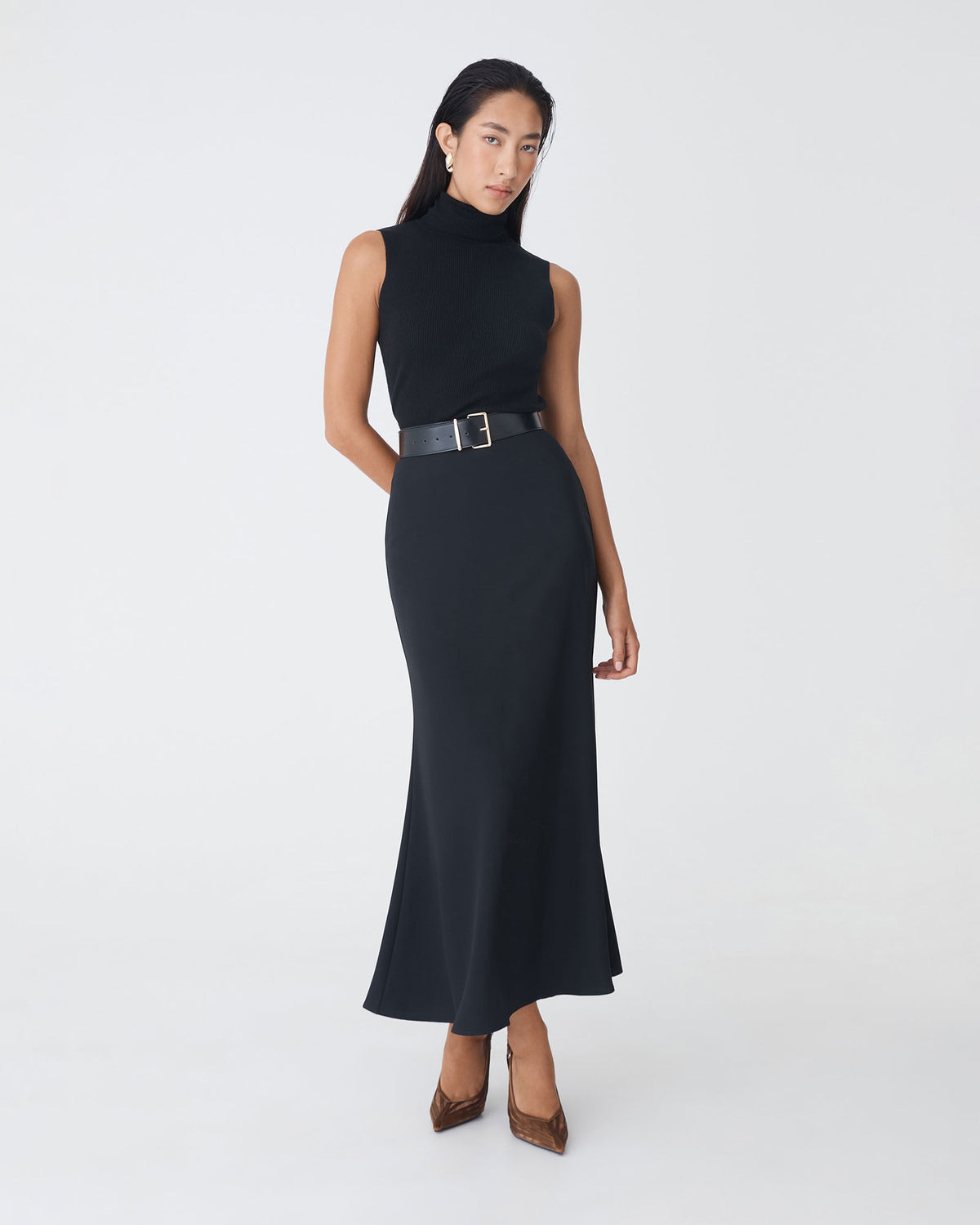 Caris Flared Maxi Skirt in black — full-length view