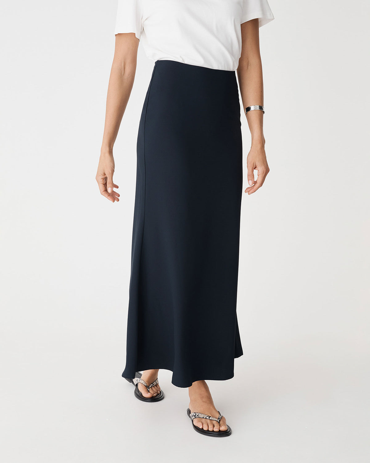 Caris Flared Maxi Skirt in navy — close-up view