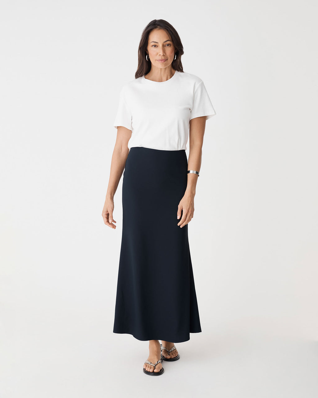 Caris Flared Maxi Skirt in navy — full-length view