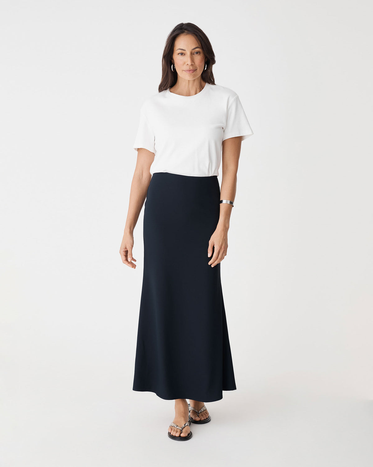 Caris Flared Maxi Skirt in navy — full-length view