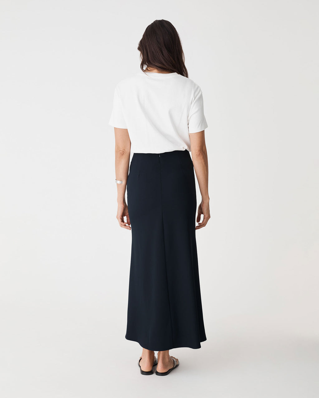 Caris Flared Maxi Skirt in navy — back view