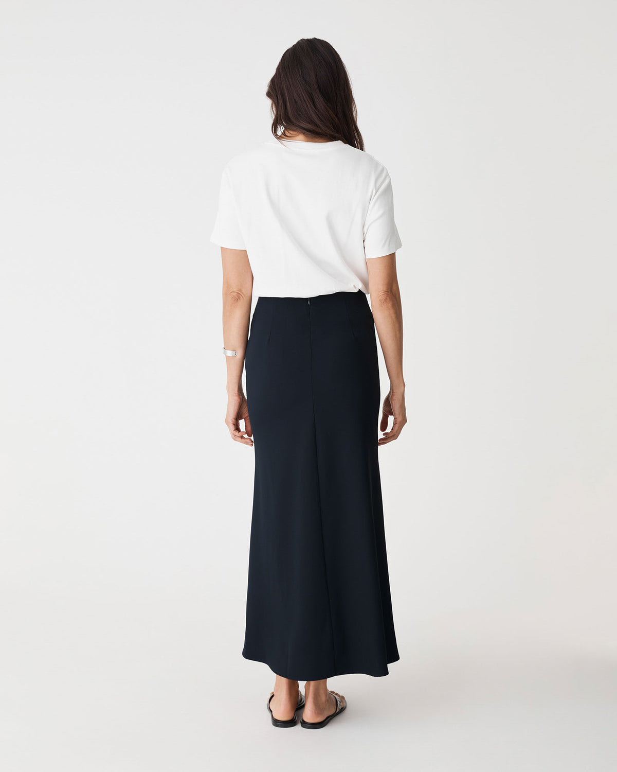 Caris Flared Maxi Skirt in navy — back view