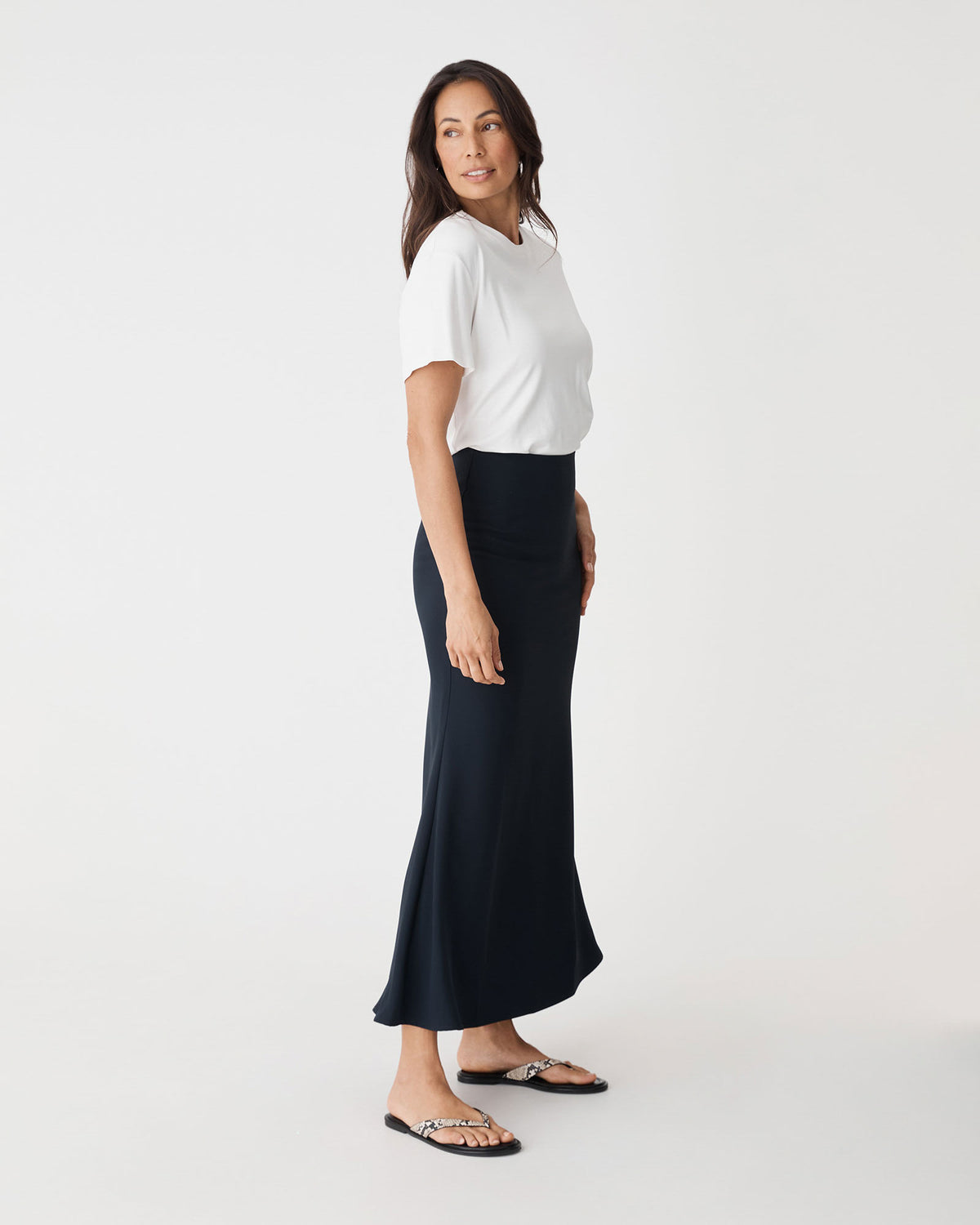 Caris Flared Maxi Skirt in navy — side view