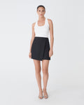 Aaria Asymmetric Skirt in black — full-length view