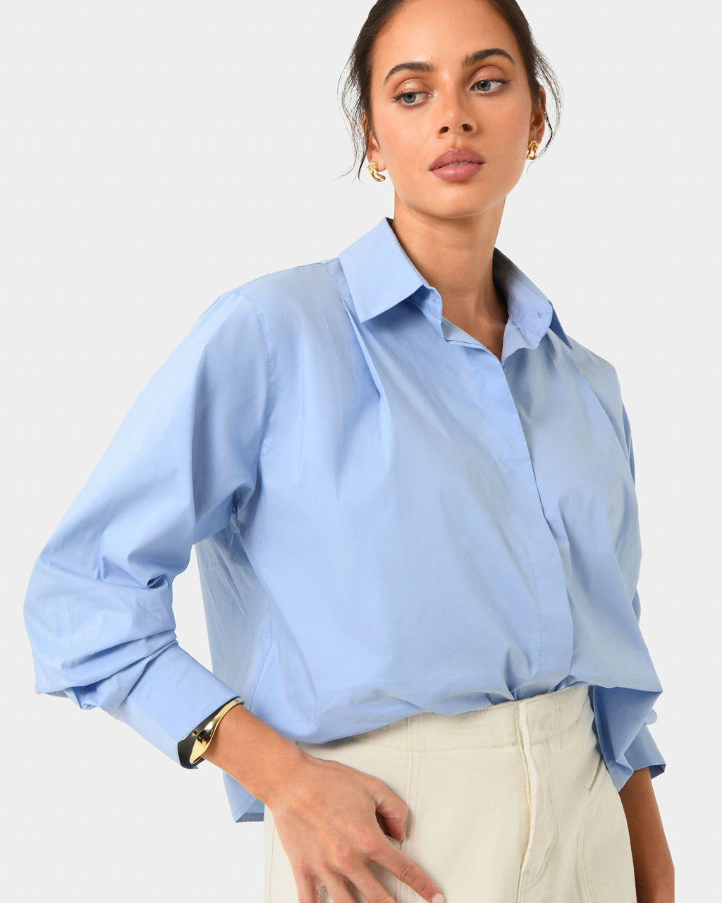 Baire Pleated Crop Shirt in blue — close-up view
