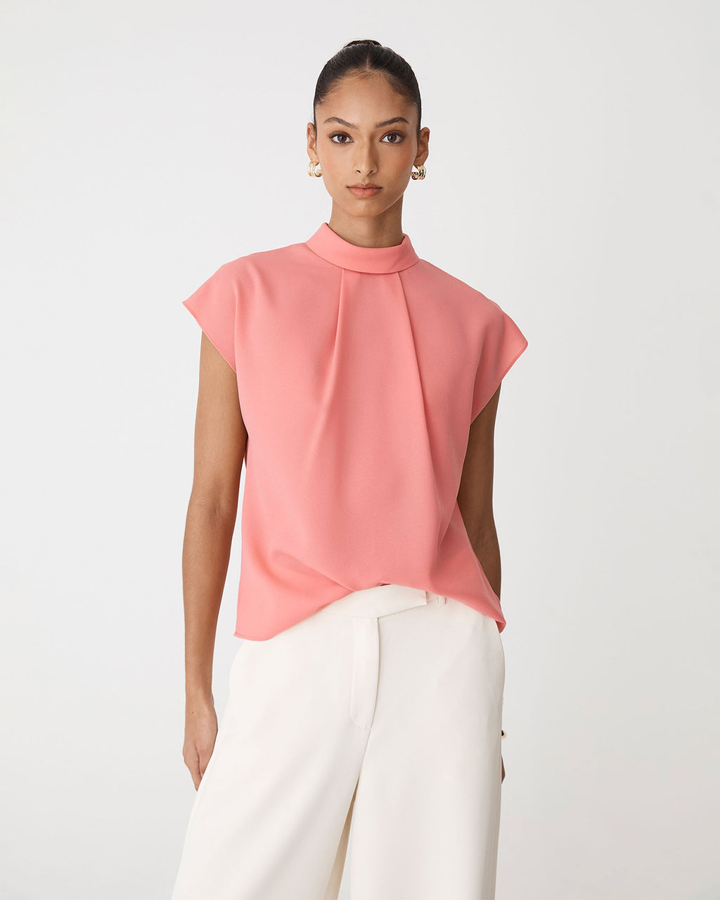 Tiara High Neck Shell Top in coral blush — close-up view