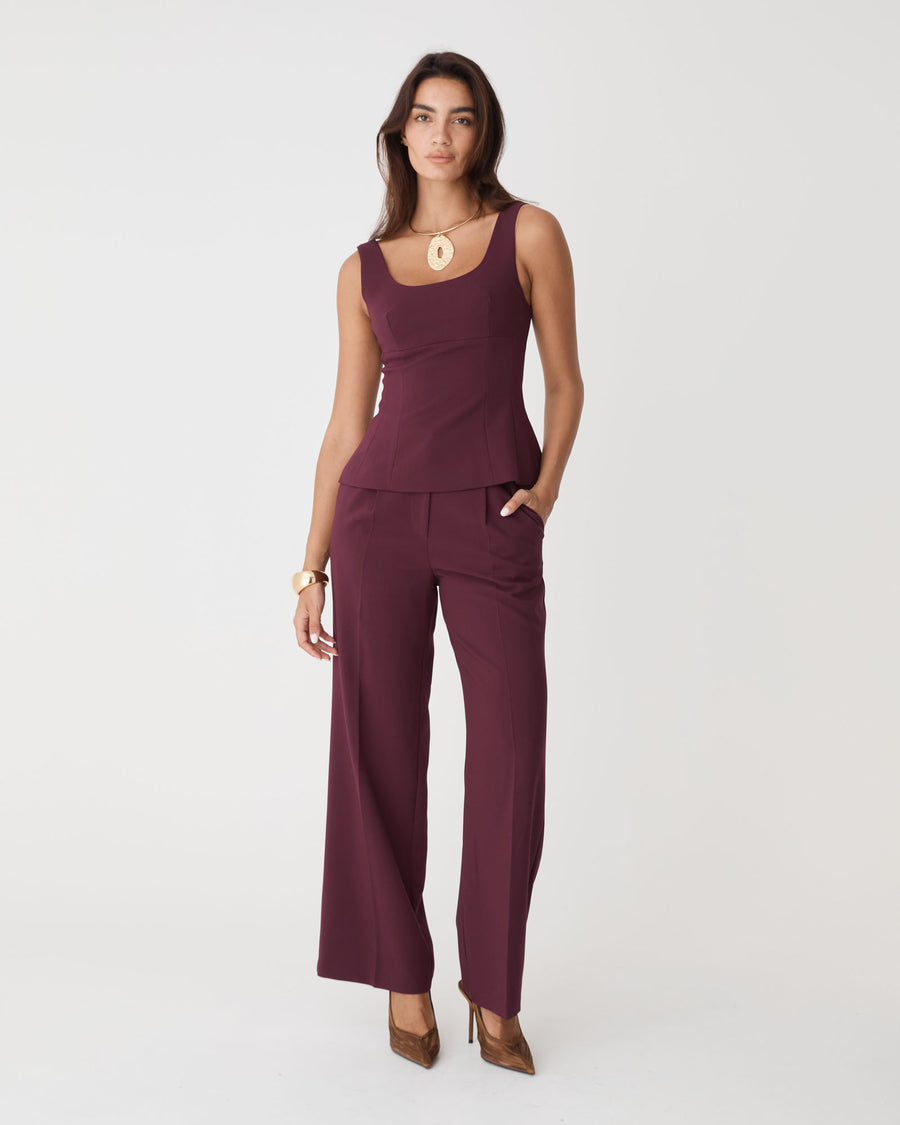 Nikki Peplum Top in bordeaux — full-length view