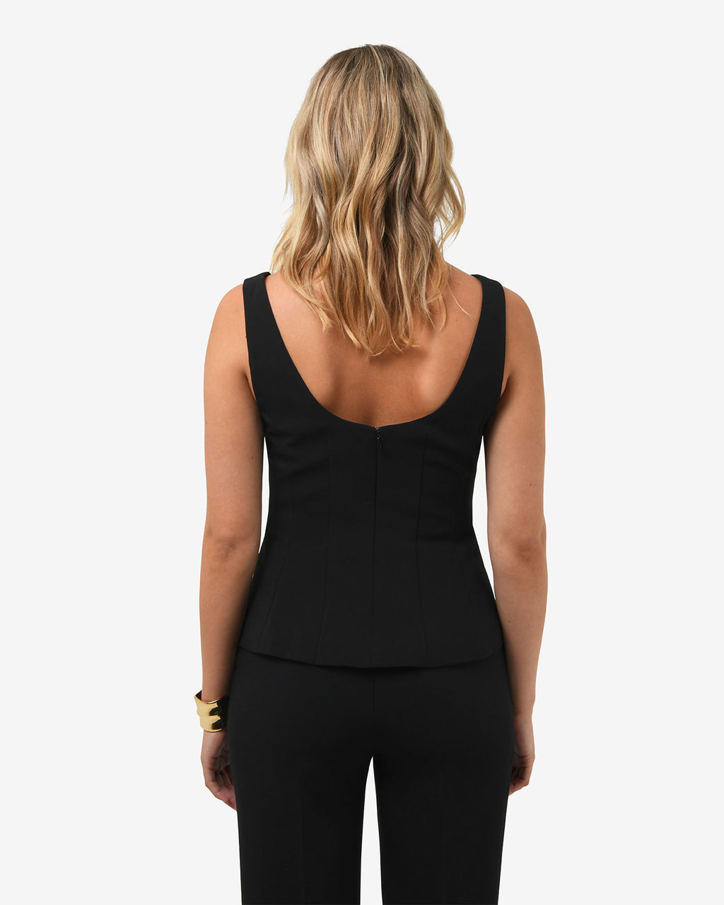 Nikki Peplum Top in black — back view
