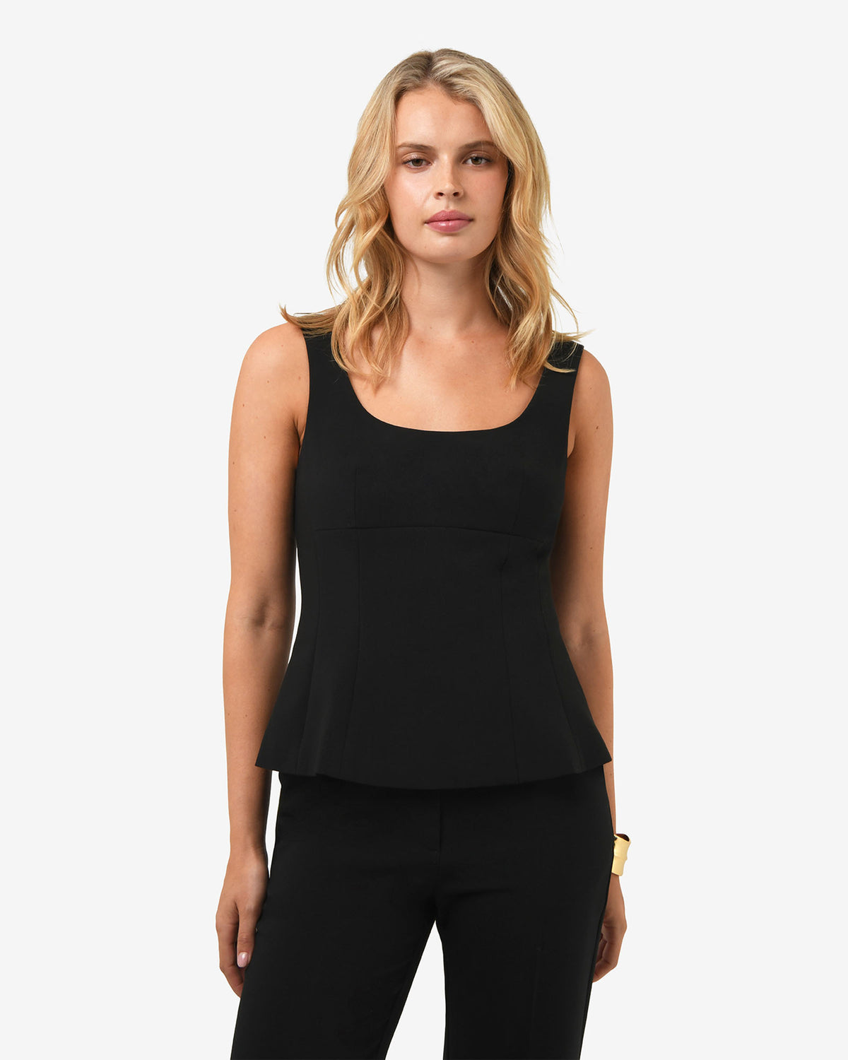 Nikki Peplum Top in black — close-up view