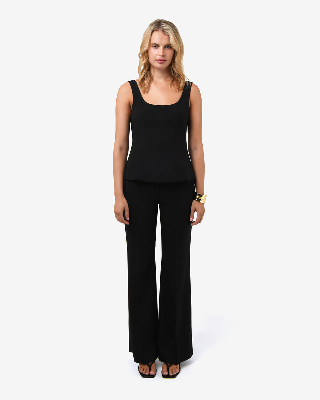 Nikki Peplum Top in black — full-length view