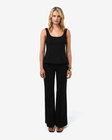 Nikki Peplum Top in black — full-length view