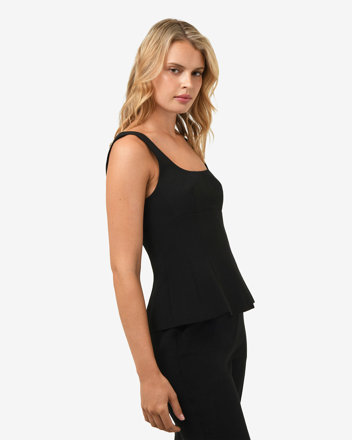 Nikki Peplum Top in black — side view