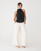 Shelby Draped Sleeveless Top in black — full-length view