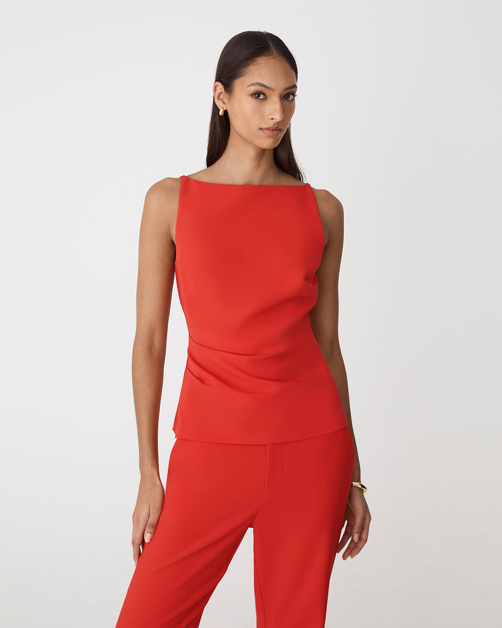 Hannah Apron Top in vermilion — close-up view