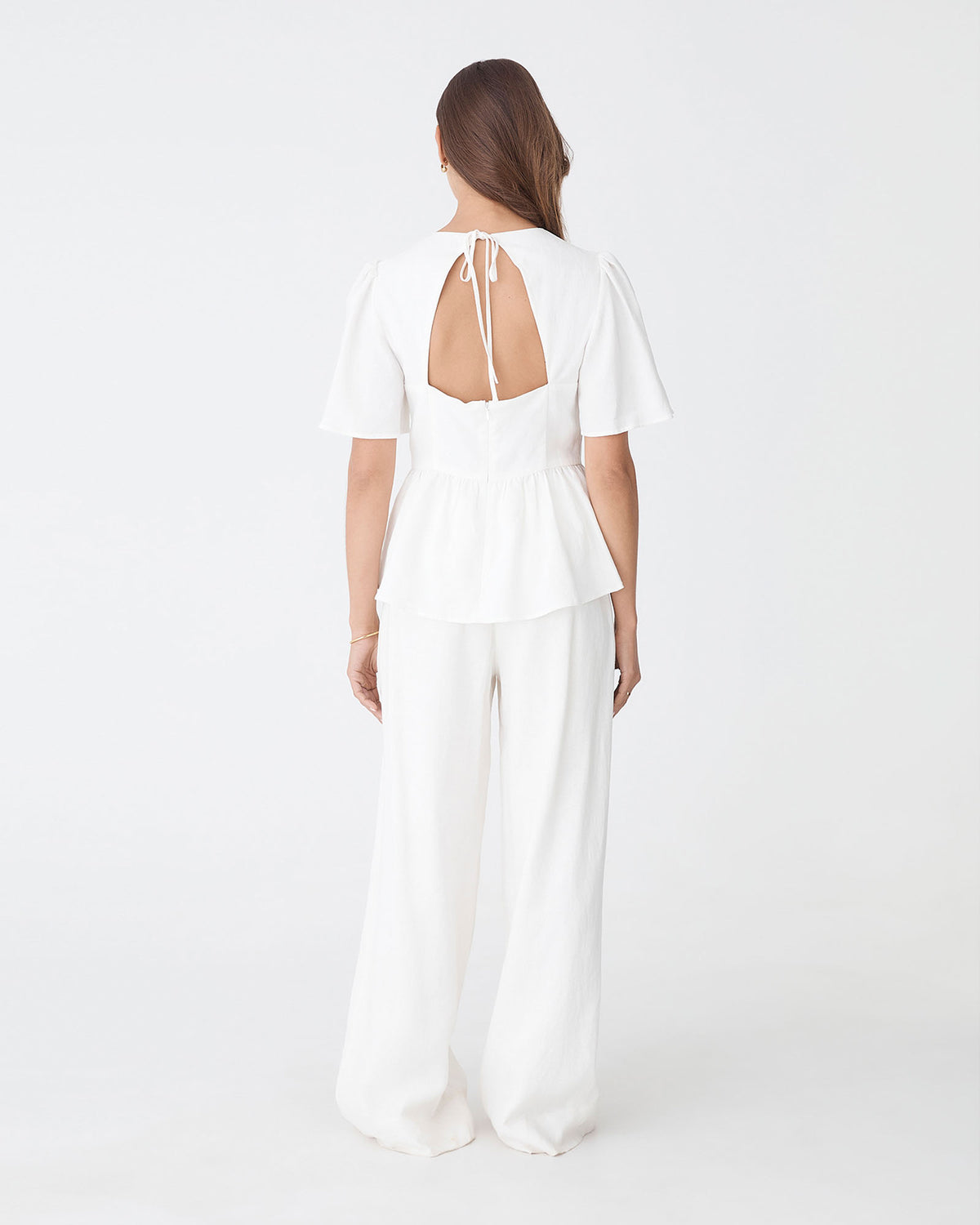 Jade Linen Peplum Top in ivory — back view 2