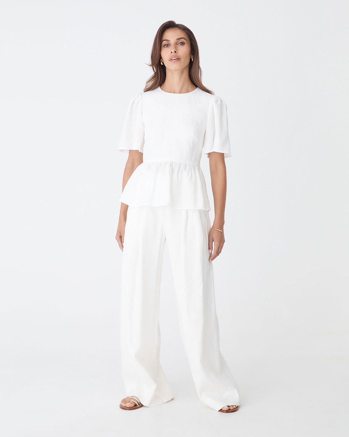 Jade Linen Peplum Top in ivory — full-length view