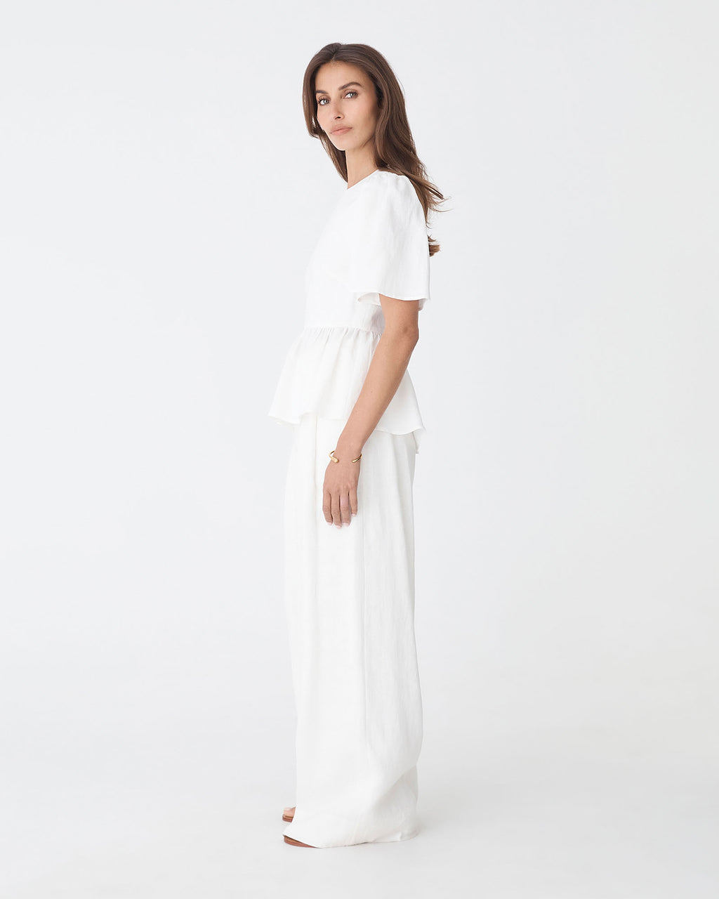 Jade Linen Peplum Top in ivory — side view
