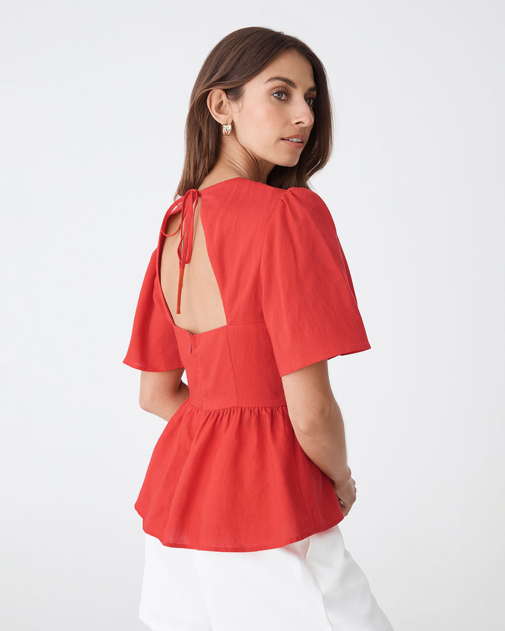 Jade Linen Peplum Top in red — back view