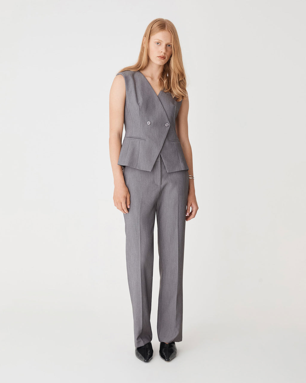 Nikki Collarless Vest in melange grey — full-length view