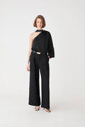 Daphne Pleated Crepe Pants in black — full-length view