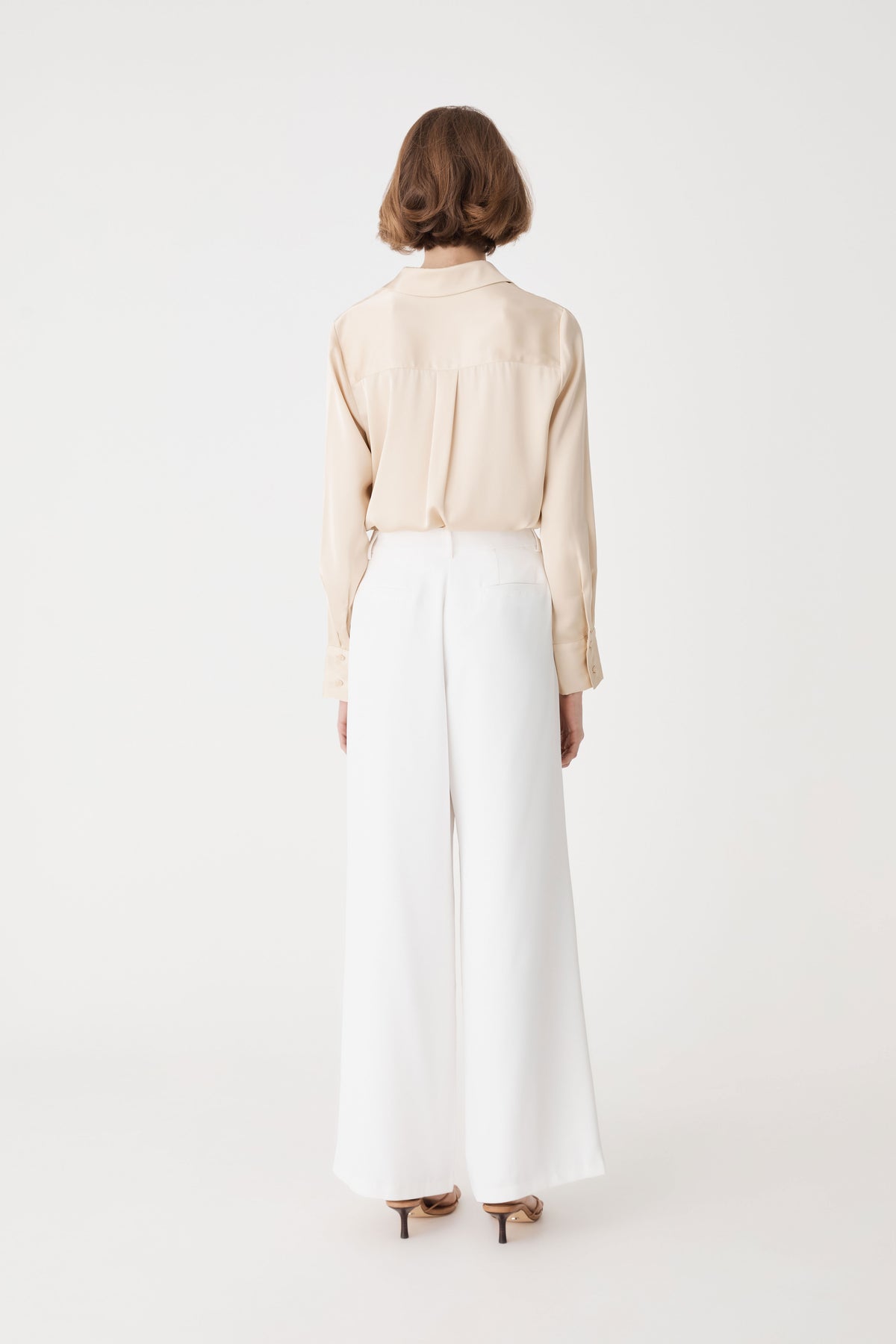 Daphne Pleated Crepe Pants in ivory — back view
