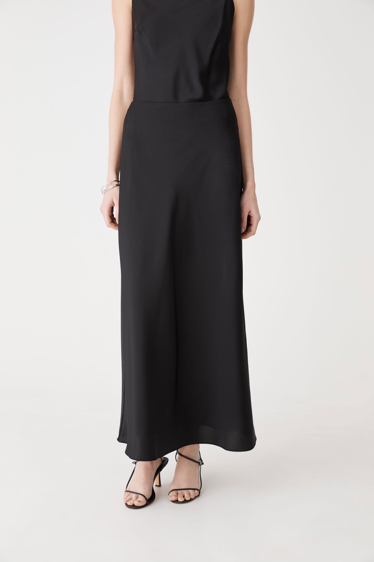 Louise Bias Satin Skirt in black — close-up view