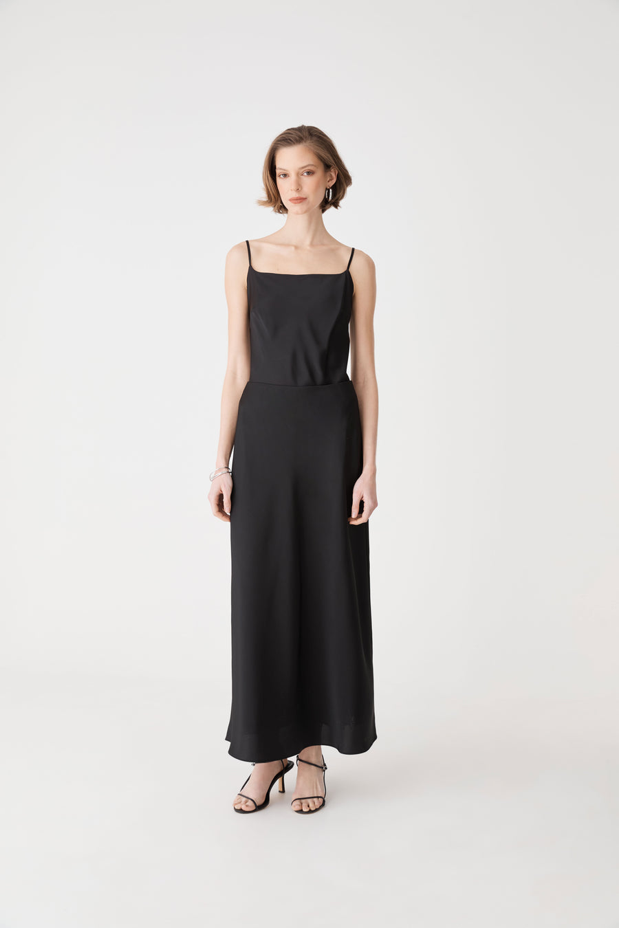 Louise Bias Satin Skirt in black — full-length view