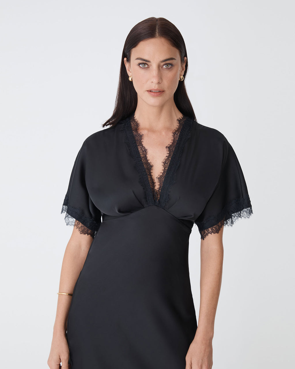 Cleo Lace Trim Satin Dress in black — close-up view