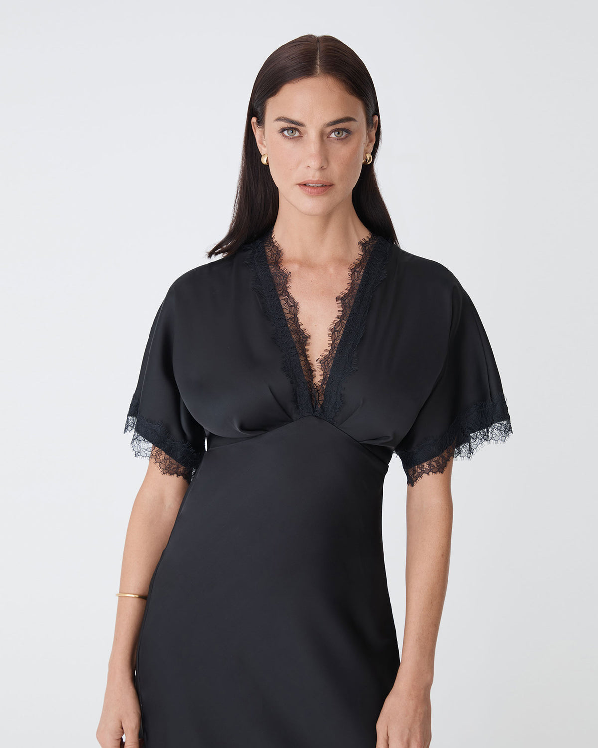Cleo Lace Trim Satin Dress in black — close-up view
