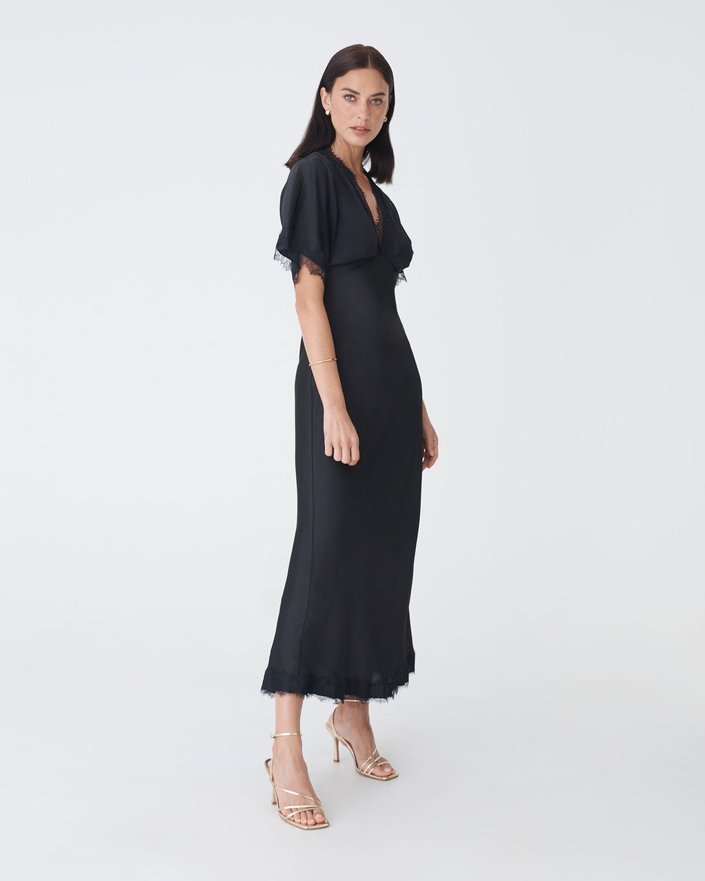 Cleo Lace Trim Satin Dress in black — side view